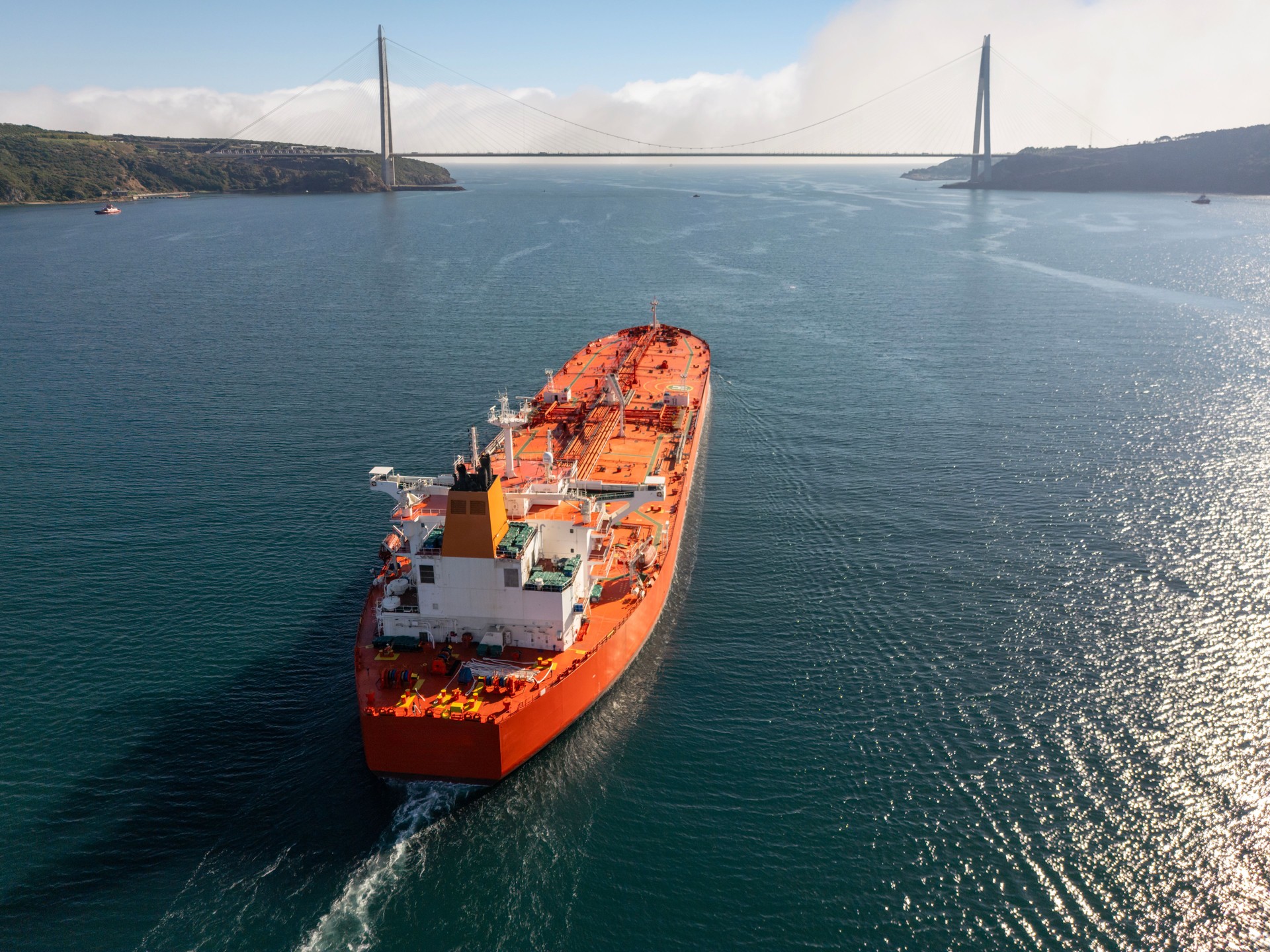 Aerial view of Huge Oil Ship Tanker transportation crude oil from refinery on the sea. Passing under Yavuz Sultan Selim Bridge.